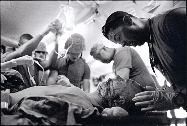 James Nachtwey, Medics with a wounded marine in Iraq, 2007