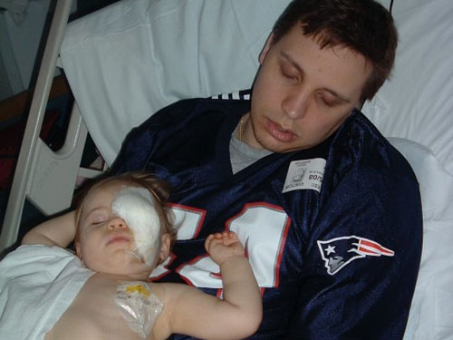 Rowan and dad sleeping after the enucleation.