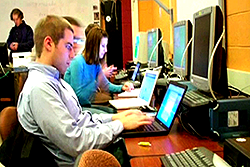 photo of students writing in computer classroom