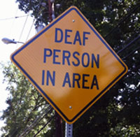 Road sign: DEAF PERSON IN AREA