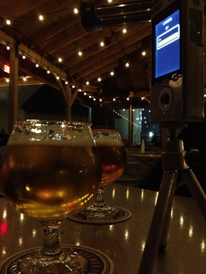 beer by recording device on bar table