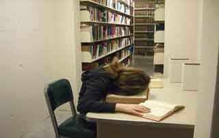 woman asleep in a library