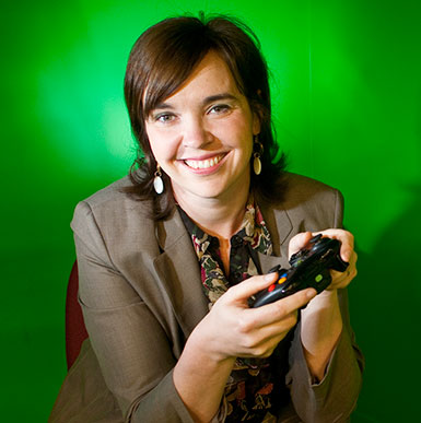 Jennifer deWinter holds a game controller