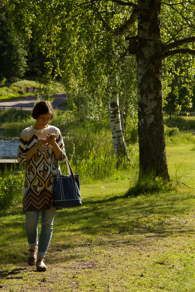 woman walking with cell phone