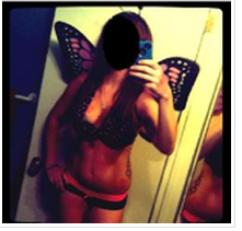 Selfie of a woman posing in a bikini. Her face is marked out.