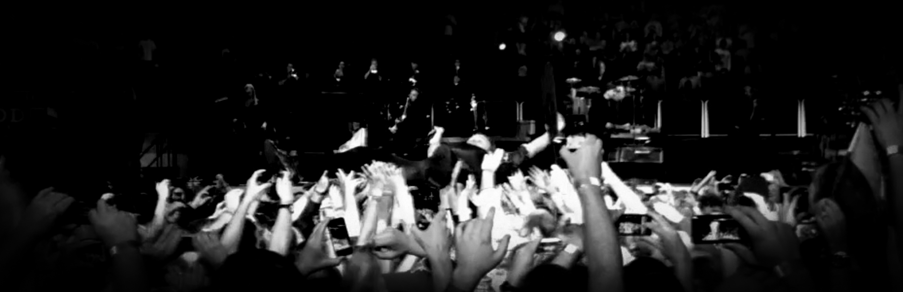 black and white photo of Bruce Springsteen crowdsurfing, Izod Center, April 2, 2012