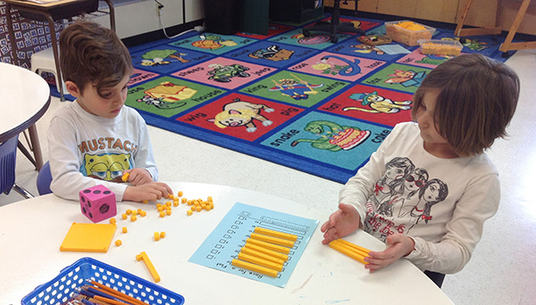 Young children playing a game in the classroom