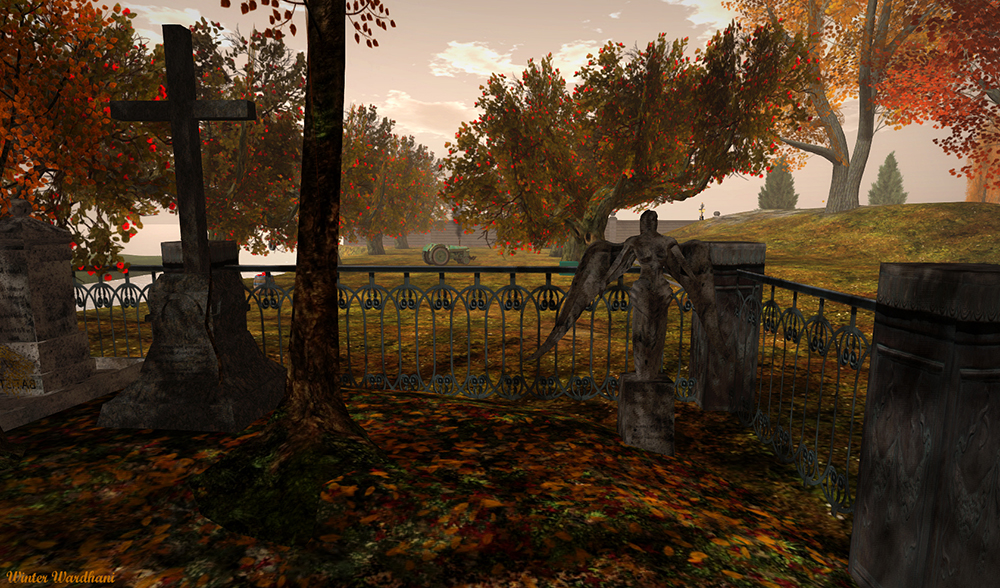 a graveyard in fall with angel scultpture and tombstones