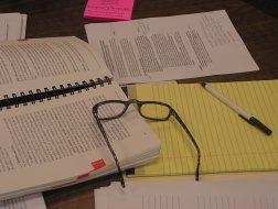 reading glasses, books, paper