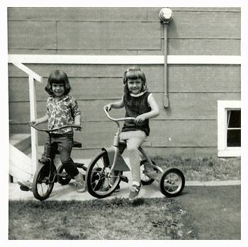 Debbie and Jodie on tricycles