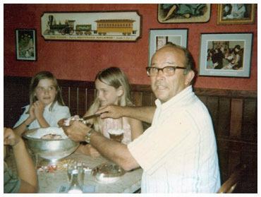 Jay at table with children