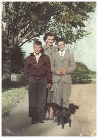 Olive with two boys and a dog