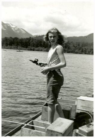 Barb standing in a boat fishing