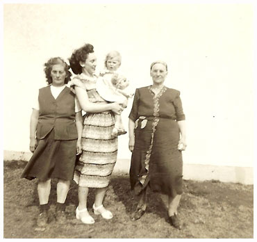 Olive with her mother, grandmother, and child