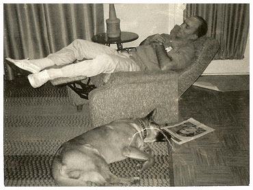 Jay sleeping in chair with Fritz the dog