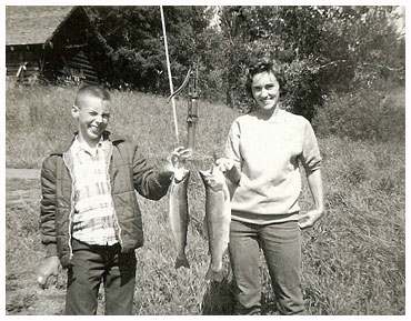 olive and son, Clint, holding up fish