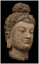 A beautiful large terracotta head of Buddha modeled in the classical Hellenistic style.