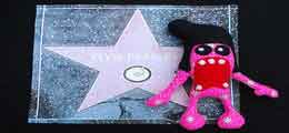 Plush Elvis Doll on top of Elvis Presley's Walk of Fame Star