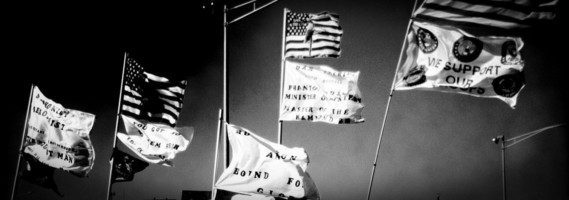 Black and white photo of flags made by fans and displayed while tailgating before the Springsteen concert at the Izod Center, April 2, 2012.