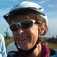 Angela Crow with a bicycle helmet on her head