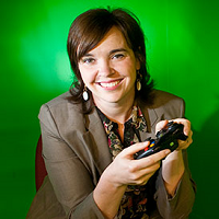 Jennifer deWinter holds a video game controller in her hands