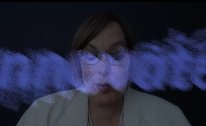 Joyce's face with the very blurry word 'innovate' in blue over her face