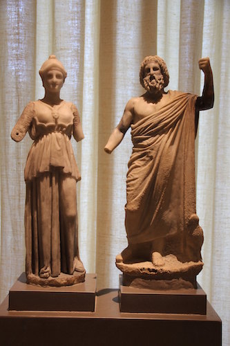Photograph of two statues, a woman and a man, at the Benaki Museum in Athens