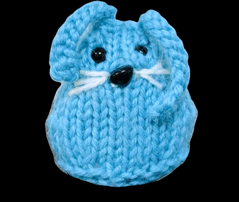 Blue knitted bunny with the text @Conference.Creatures beneath the image.