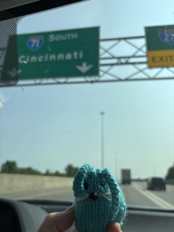 CC underneath a road sign that indicates the direction to Cincinnati, where the 2025 RSA Institute was held.