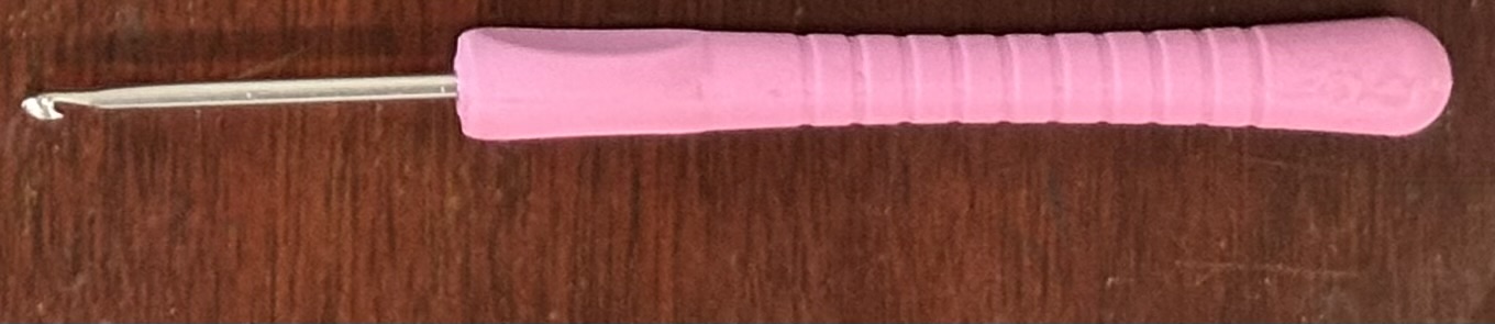 A pink crochet hook.