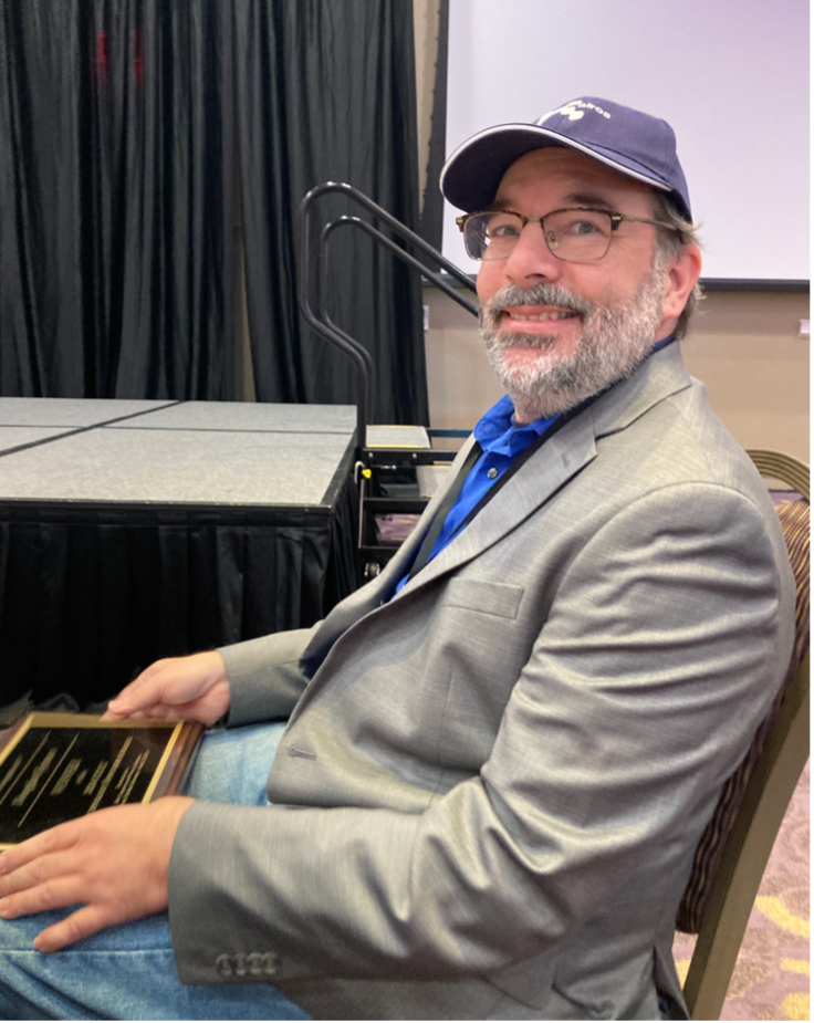 A photo of Doug Eyman. smiling