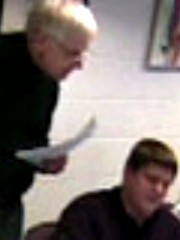 Payne helps a student.