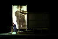 Image of Charlie Chaplin looking down at a visitor leaving the CompuObscura. Taken by Cal Poly Architecture class students using class-created model and slide projector, Spring 2004.