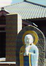 Image of Buddah statue at temple, at the foot of an erupting volcano. Kyushu Prefecture, Japan. Photo by David Gillette  2005.