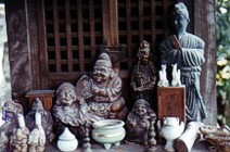 Burning incense and display of religious icons. Nara, Japan. Photo by David Gillette  2005.